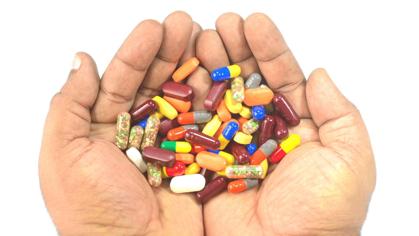 Various supplement pills, capsules and bottles spread out